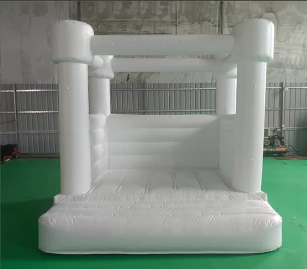 All-white inflatable bounce house, seen from the front